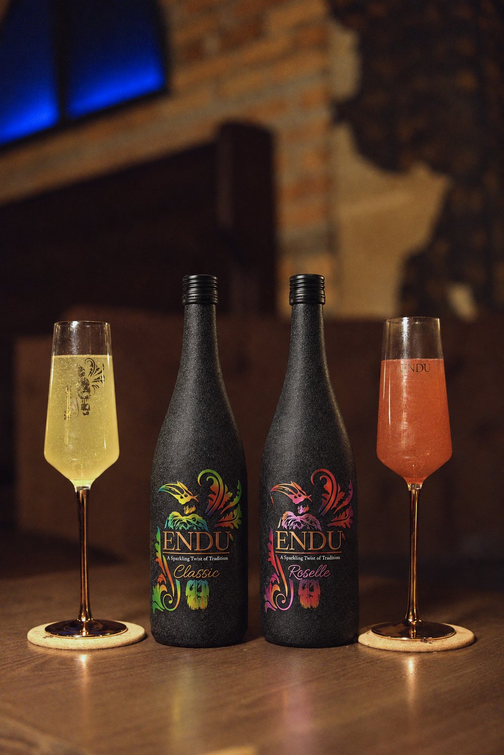 ENDU Classic and ENDU Roselle bottles with poured glasses in a bar setting